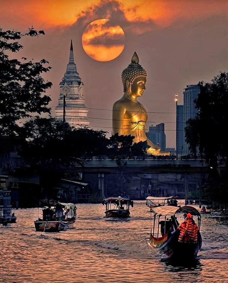 buddha statue in Thailand seen from the river